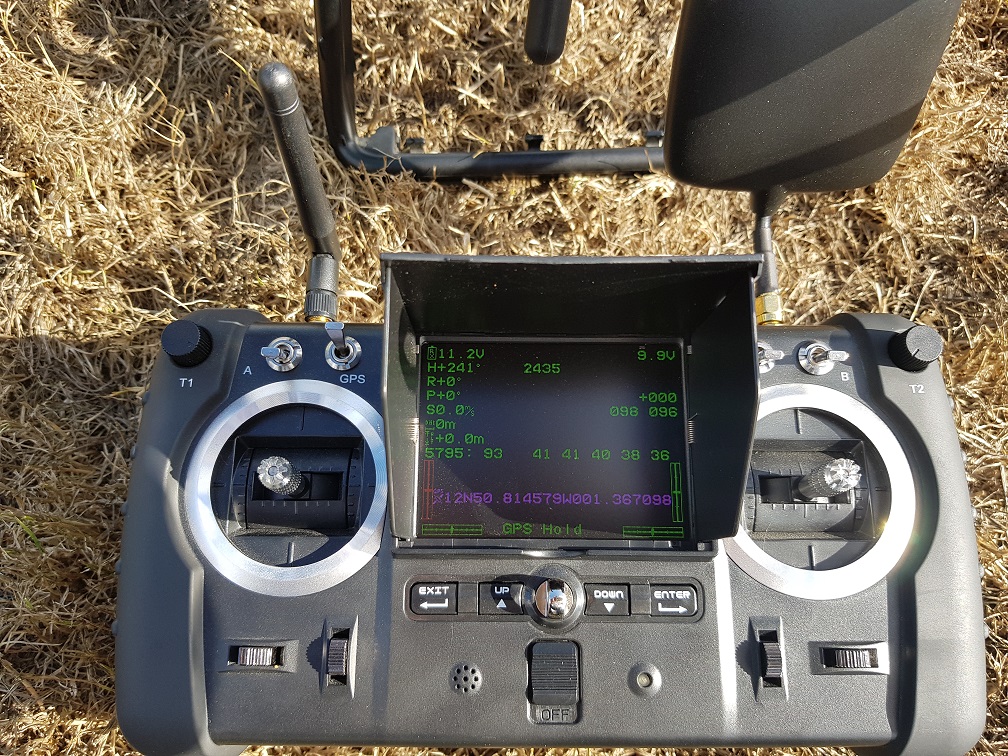handset next to drone after flying.jpg
